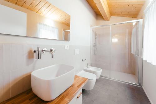 a bathroom with a sink and a toilet and a shower at Locanda dell'Ortolano in Ferrara