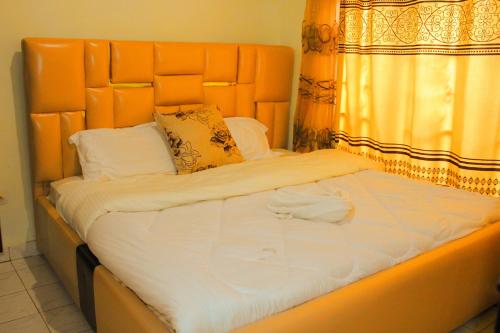 Llit o llits en una habitació de Heritage House Rwanda