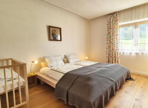 a bedroom with a bed and a window at Almliesl KRIS-750 in Krispl