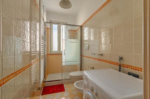 a bathroom with a toilet and a shower and a sink at Casetta Di Denny in Polignano a Mare