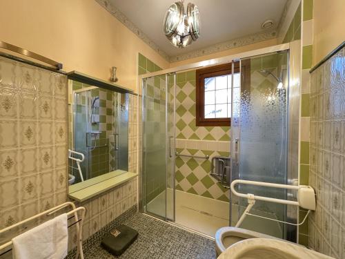 a bathroom with a shower and a glass shower stall at La Changéenne - Maison de charme - 12 pers in Changé