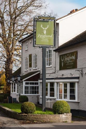 a sign for a restaurant in front of a building at The Haughmond in Shrewsbury