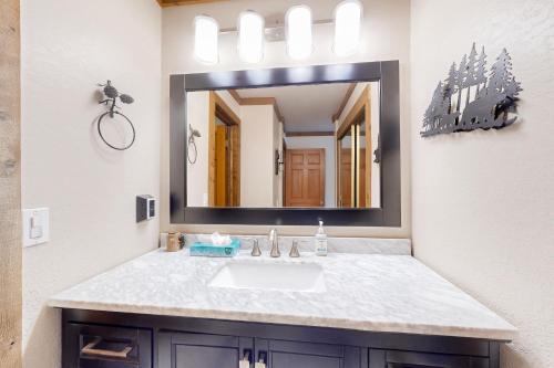 a bathroom with a sink and a mirror at Mountainback 47 in Mammoth Lakes