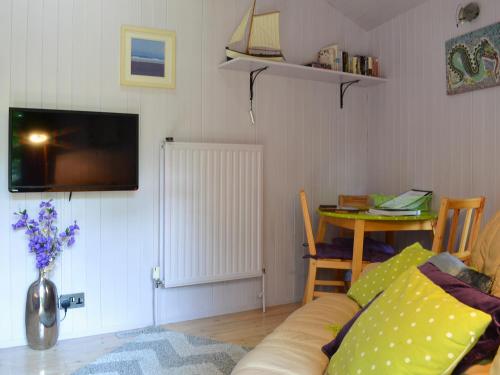 a living room with a couch and a table at Beach Retreat - Ukc2322 in St Ives