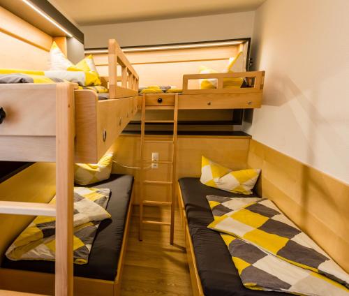 two bunk beds in a dorm room with twounks at Ferienwohnung Abraham in Nauders