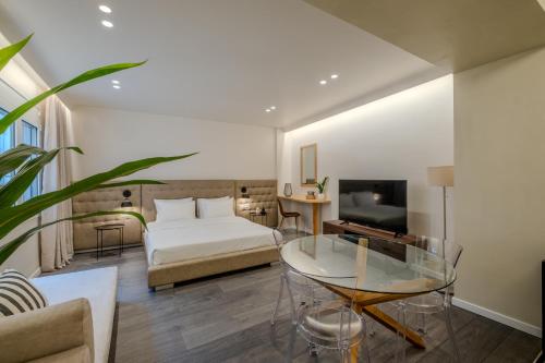 Llit o llits en una habitació de Athensis Central Suites