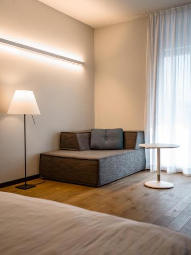 a living room with a couch and a table at b20 - serviced apartments bern ag in Bern