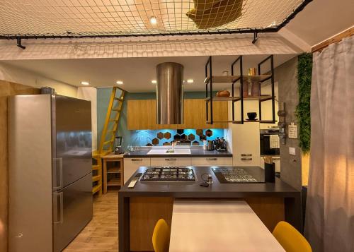 a kitchen with a stainless steel refrigerator and a stove at Celia Center Celje Apartment in Celje