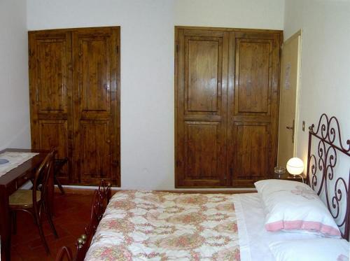 Una cama o camas en una habitación de Residence Casprini da Omero