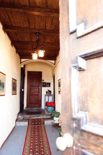 a hallway of a building with a door and a rug at Ca' del Giuli in Maslianico