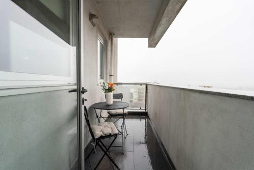 Modern Flat with Balcony & Garage by HostWise
