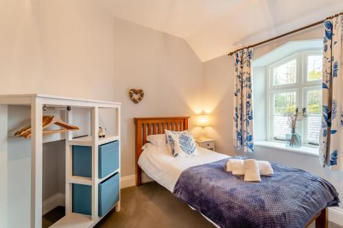 a bedroom with a bed and a window at 2 Bed in Selside oc-ds1067 in Selside