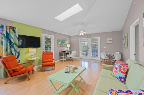 a living room with a couch and chairs and a table at Siesta-Retreats - Key West Unit in Siesta Key