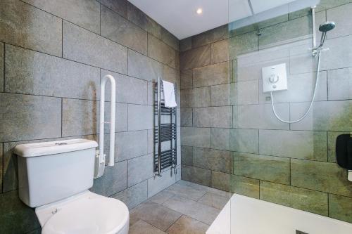 a bathroom with a toilet and a shower at Slyne Lodge in Hest Bank