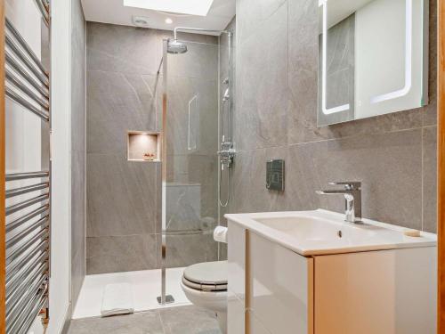 a bathroom with a toilet and a sink and a shower at 1 Bed in Taunton oc-80693 in North Curry