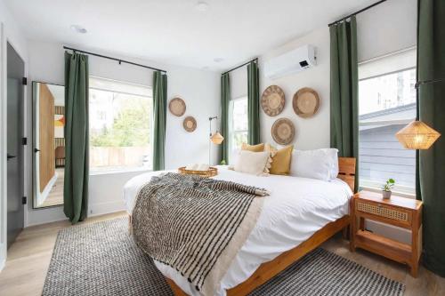 a bedroom with a bed with a large window at Champagne Wishes in Atlanta