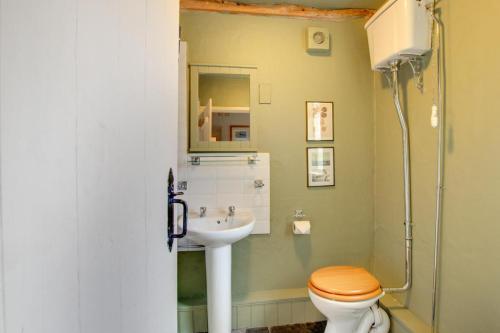 a bathroom with a toilet and a sink at 3 Bed in Little Langdale oc-gl102 in Little Langdale