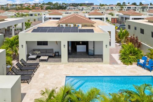 an aerial view of a house with a swimming pool at Villa Jasmijn, Mambo Beach, Private Pool in Willemstad