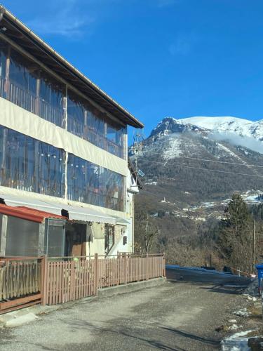 a building with a view of a mountain at Casa Gallo Music Room in Lamon