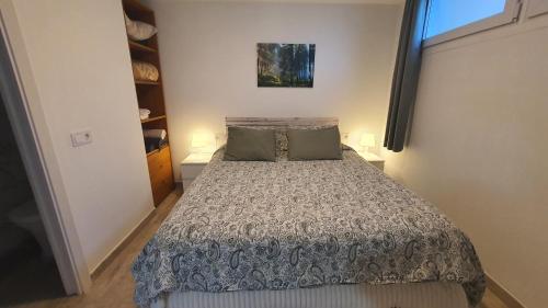 a bedroom with a bed in a small room at Vallgorguina Uno in Vallgorguina