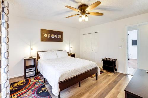 a bedroom with a bed and a ceiling fan at Work, Explore & Unwind: Greenville Getaway w/ Yard in Greenville