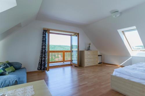 A bed or beds in a room at Szlovén Mintagazdaság