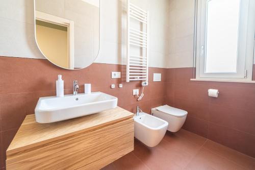a bathroom with a sink and a toilet at Penelope al mare 6 in Alba Adriatica