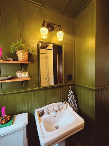 a bathroom with a sink and a mirror at Campo Carnelian in Carnelian Bay