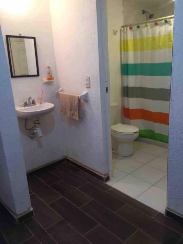 a bathroom with a sink and a toilet at Casa Sustentable Monarca Angangueo in Mineral de Angangueo