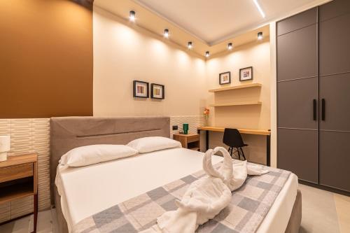 a bedroom with a bed with white towels on it at Penelope al mare 20 in Alba Adriatica