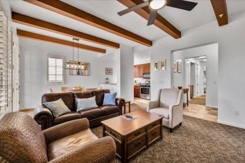 a living room with a couch and a table at Poolside Greens 2BR Legacy Villa in La Quinta