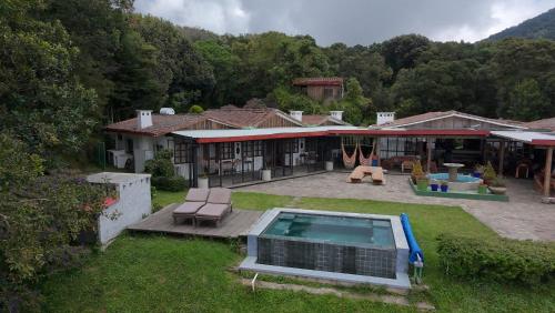 an aerial view of a house with a swimming pool at Sueño Verde EcoVilla in Cerro Verde