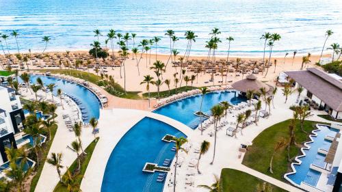 an aerial view of the beach and the pool at a resort at Secrets Tides Punta Cana - All Inclusive in Punta Cana