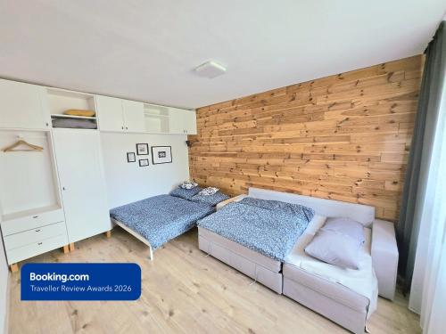 a room with a bed and a couch in it at Apartman Point in Štrba