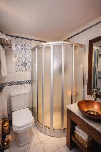 a bathroom with a shower and a toilet and a sink at YOU Nile View Hotel in Cairo