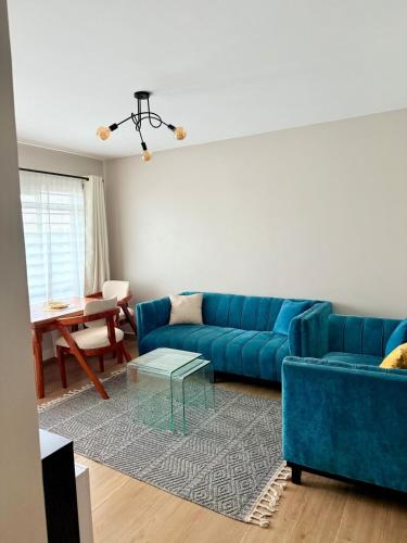 Posezení v ubytování Ruby Homes 2 Bedroom - TRM Drive