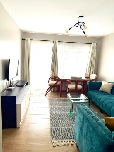 TV a/nebo společenská místnost v ubytování Ruby Homes 2 Bedroom - TRM Drive