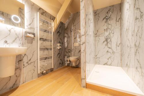 a bathroom with a toilet and a sink at Château de Looz in Borgloon