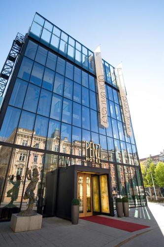 a large glass building with a sign on it at The PENZ Hotel in Innsbruck