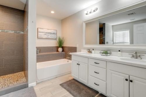 a bathroom with a tub and a sink and a shower at Relax Poolside: Central Group Getaway in Mesa! in Mesa