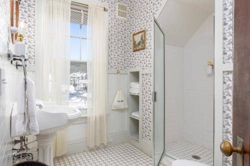 a bathroom with a sink and a shower at The Berkshire Mountain Inn in Great Barrington