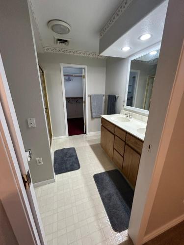 a bathroom with a sink and a mirror at The Palace in Mandan