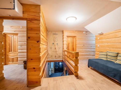 a log cabin bedroom with wooden walls and a bed at Chata Lion in Pec pod Sněžkou