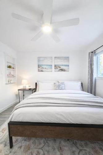 a white bedroom with a large bed and a window at Cozy 1BR Apartment in Phenomenal Austin - Minutes to Downtown in Austin