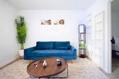 a living room with a blue couch and a coffee table at Cozy 1BR Apartment in Phenomenal Austin - Minutes to Downtown in Austin