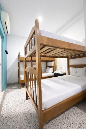 a bedroom with two bunk beds in a room at Hotel Babilonia Boutique in Cúcuta