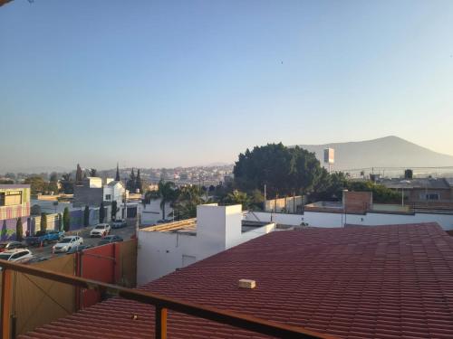 a view of a city from the roof of a building at Estudio Lavanda in Santa Rosa de Jáuregui