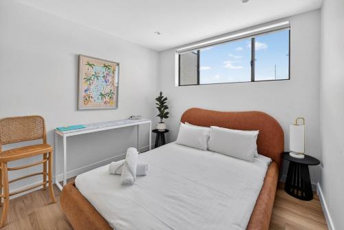 a small bedroom with a bed and a window at Bonanza Lane Hideaway in Sydney