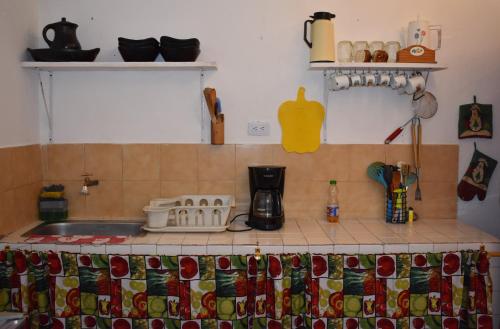 a kitchen with a counter top with a sink and a counter top at El Hostal del Abuelo in Murillo
