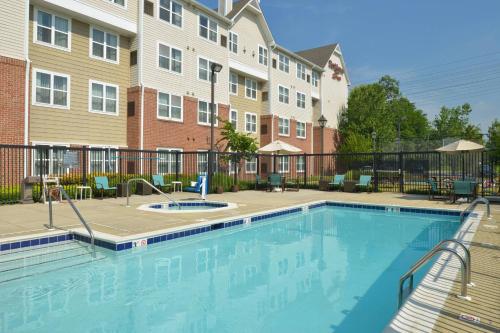 a swimming pool in front of a building at Residence Inn Baltimore White Marsh in Baltimore